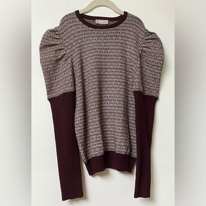 One child burgundy and cream patterned sweater